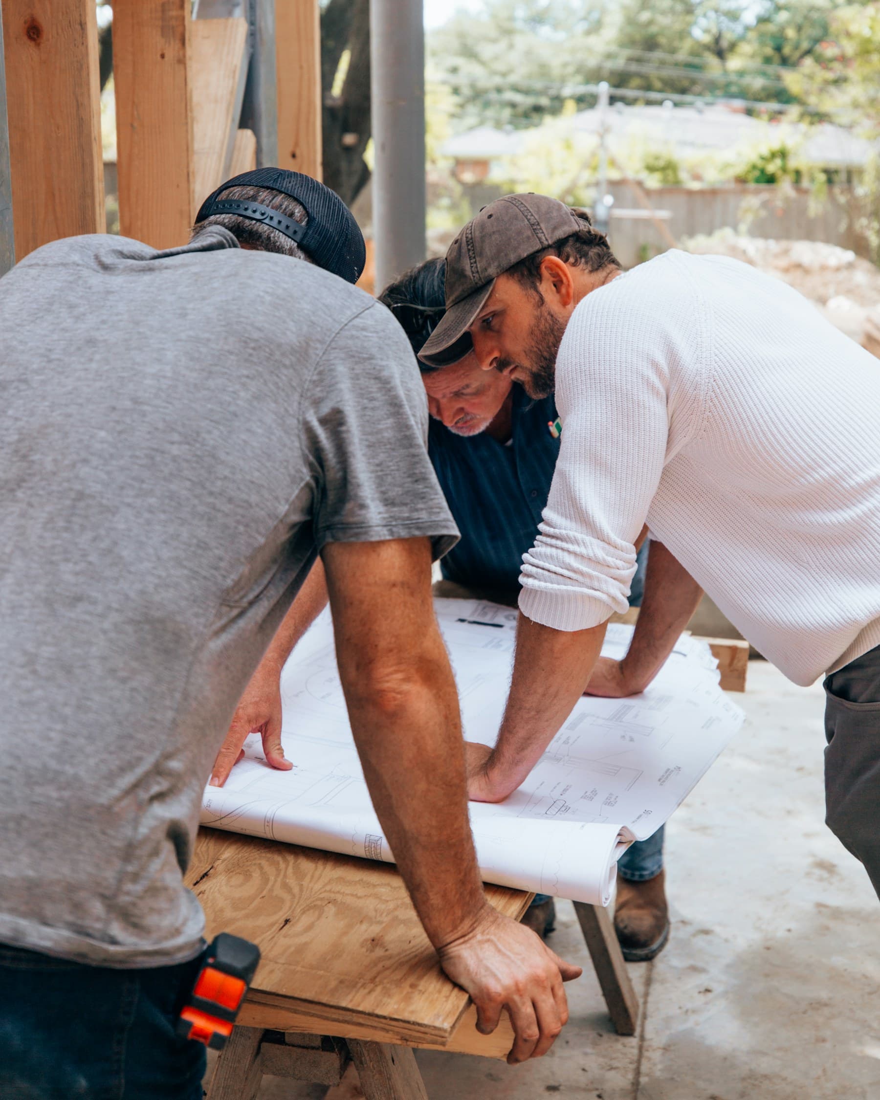 Construction team reviewing plans on site