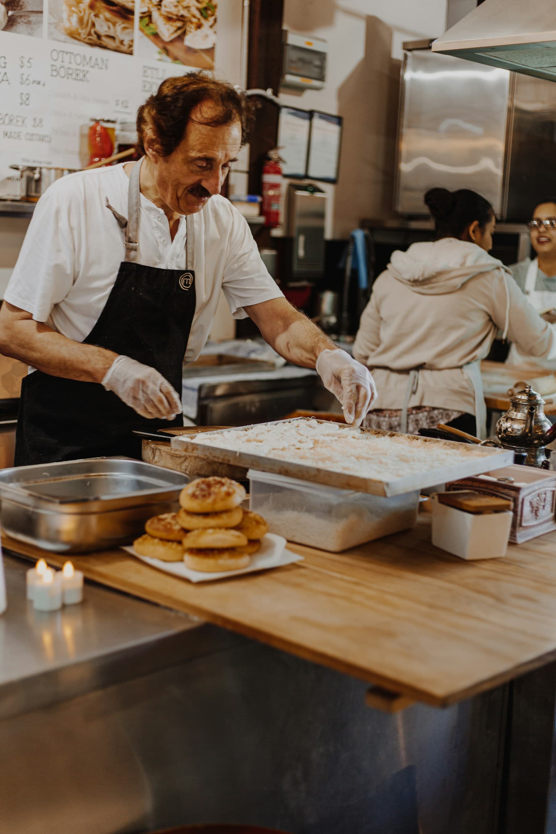 Restaurant owner preparing food for customers