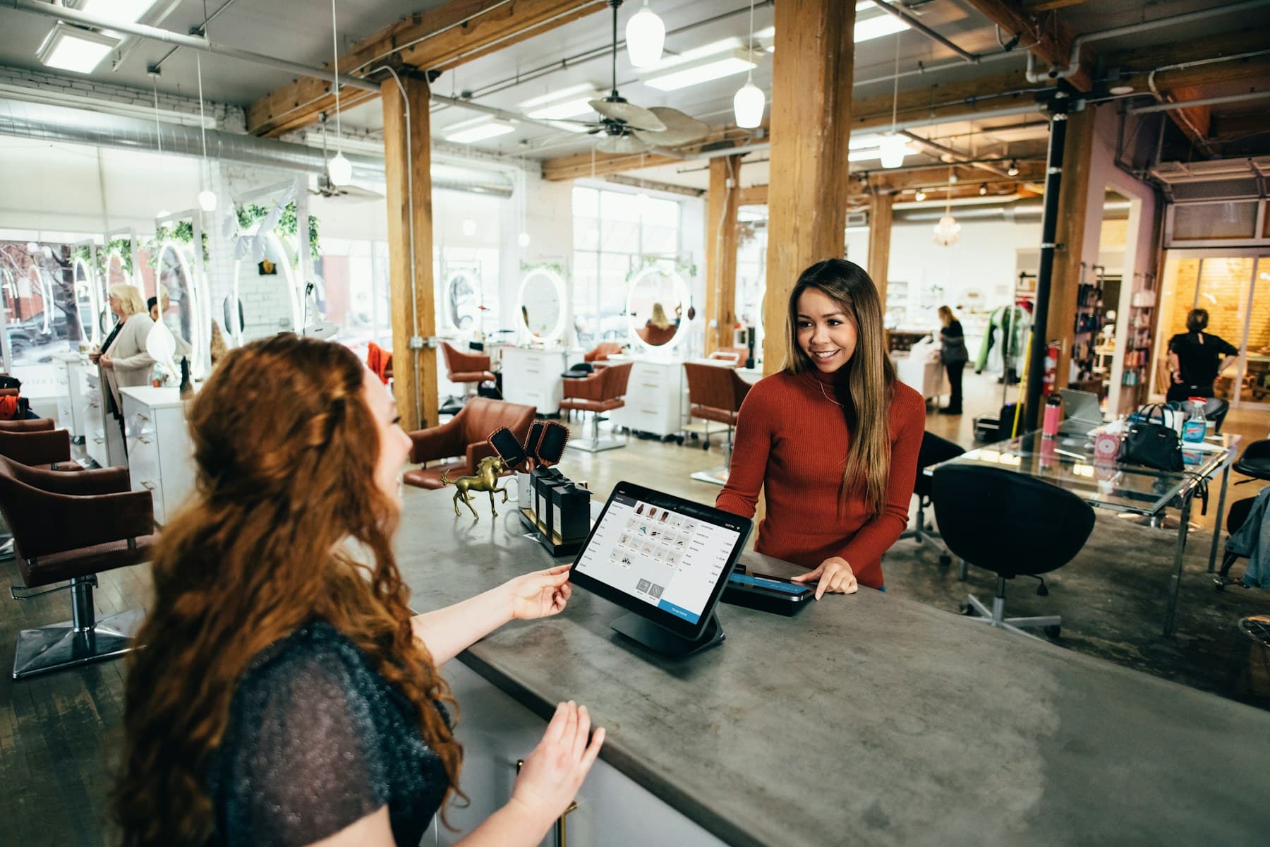 Retail business owner speaking with a customer